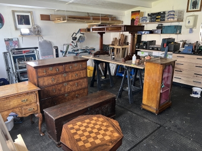 Flood damaged furniture collection Collection of flood damaged furniture nearing completion in the workshop